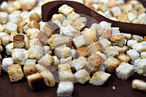 Crispy freshly sauteed crunky croutons made of cubes white bread.