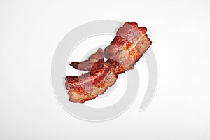 Crispy fried bacon isolated on a white background.