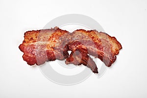 Crispy fried bacon isolated on a white background.