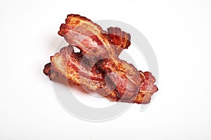 Crispy fried bacon isolated on a white background.