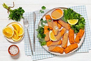 crispy fried breaded fish sticks on a plate