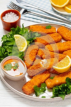 crispy fried breaded fish sticks on a plate