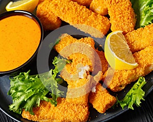 crispy fried breaded fish sticks on a plate