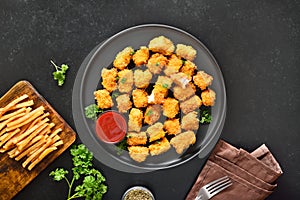 Crispy fried chicken nuggets on plate