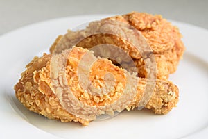 Crispy fried chicken in a white plate