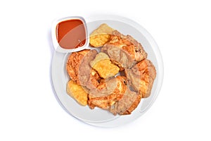 Crispy fried chicken  in a white plate on white background