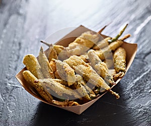 Crispy fried okra in container