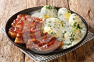 Crispy fried pork belly with creamy parsley sauce, or stegt flÃ¦sk med persillesovs, is a classic Danish dish