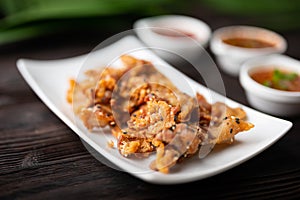 Crispy fried sliced belly pork with spicy sauce