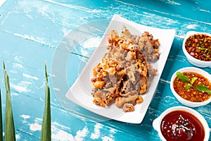 Crispy fried sliced belly pork with spicy sauce