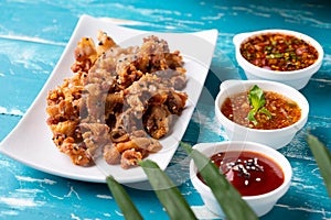 Crispy fried sliced belly pork with spicy sauce