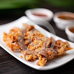 Crispy fried sliced belly pork with spicy sauce