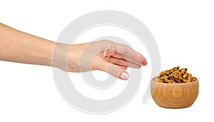 Crispy granola, dried fruits with grains. Wooden bowl