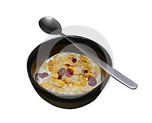 Crispy and healthy organic breakfast cereal flakes with red dried cranberry and cold soy milk in dark black handmade pottery bowl