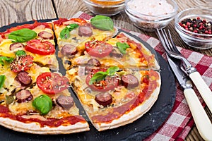 Crispy hot pizza on old wooden table