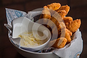 CRISPY JOJOS sticks with dip served in a dish isolated on table side view photo