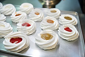 Crispy merengue nests filled with fresh and sweet fruit curd mousse photo