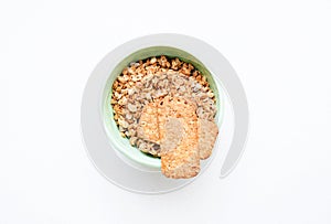 Crispy muesli dry Breakfast in a bowl isolated on white background selective focus, top view
