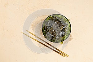 Crispy nori seaweed on bowl. Traditional Japanese dry seaweed sheets.