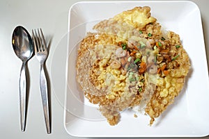 Crispy omelet with shrimp and vegetable on top