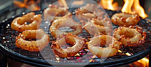 Crispy onion rings fried to perfection in golden oil, achieving ultimate crunchiness