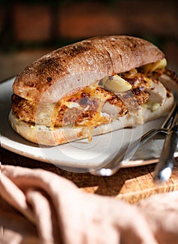 Crispy Panko chicken sandwich with cheese on plate