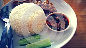 Crispy pork rice serves with chili source and vegetable asian foods style street foods delicious