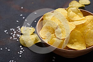 Crispy potato chips in bowl