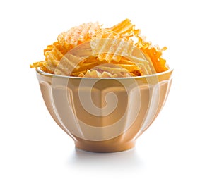 Crispy potato chips in bowl isolated on white background