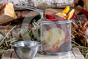 Crispy potato chips with chutney on rustic background