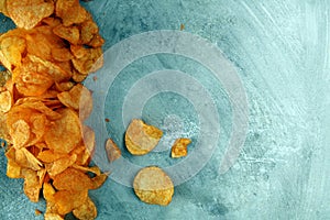 Crispy potato chips. Paprika chips on table. Spicy crunchy chips