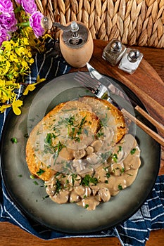 Crispy potato pancakes with mushroom sauce photo