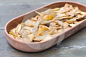 Crispy potato skins in crockery