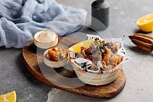 Crispy Prawns and Calimari with dip and lime served in dish isolated on table top view of arabic breakfast