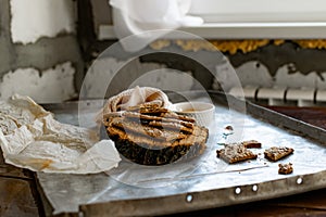 Crispy rectangular crispbreads with sesame seeds and seeds with natural honey in an interestingly decorated composition with wood