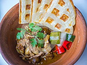 Crispy roti with Indian curry and vegetables