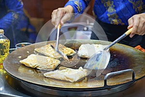 Crispy Roti Vendor at the Street Corner
