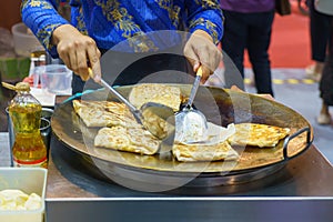 Crispy Roti Vendor at the Street Corner