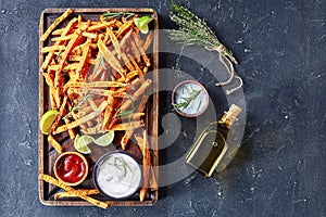 Crispy salty Sweet Potato Fries on a board