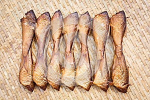 Crispy smoke dried siamese mud carp fish