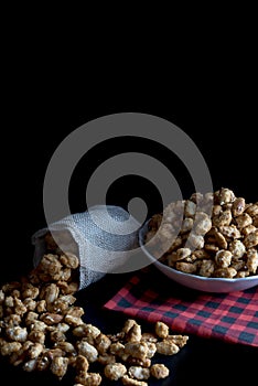 Crispy Sugared peanuts in Sack and white cup