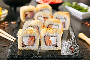 Crispy Tempura Maki Sushi Rolls or Uramaki with Raw Salmon