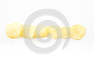 Crispy thinly sliced potato chips, on white