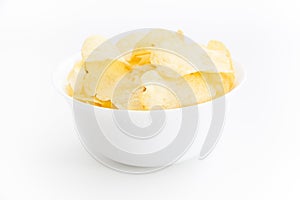 Crispy thinly sliced potato chips in white bowl