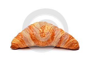 Crispy traditional croissant on a white background. Homemade baking