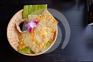 Crispy wonton. Fried wonton sheets in basket.