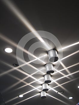 Crisscrossing Light beams on ceiling