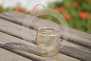 Cristal candle holder on wood outdoors table