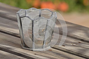 Cristal candle holder on wooden outdoors table