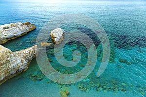 Cristal clear turquoise water and the sea urchins on bottom, coast of Crete, Greece. wave pattern, wind ripples the sea